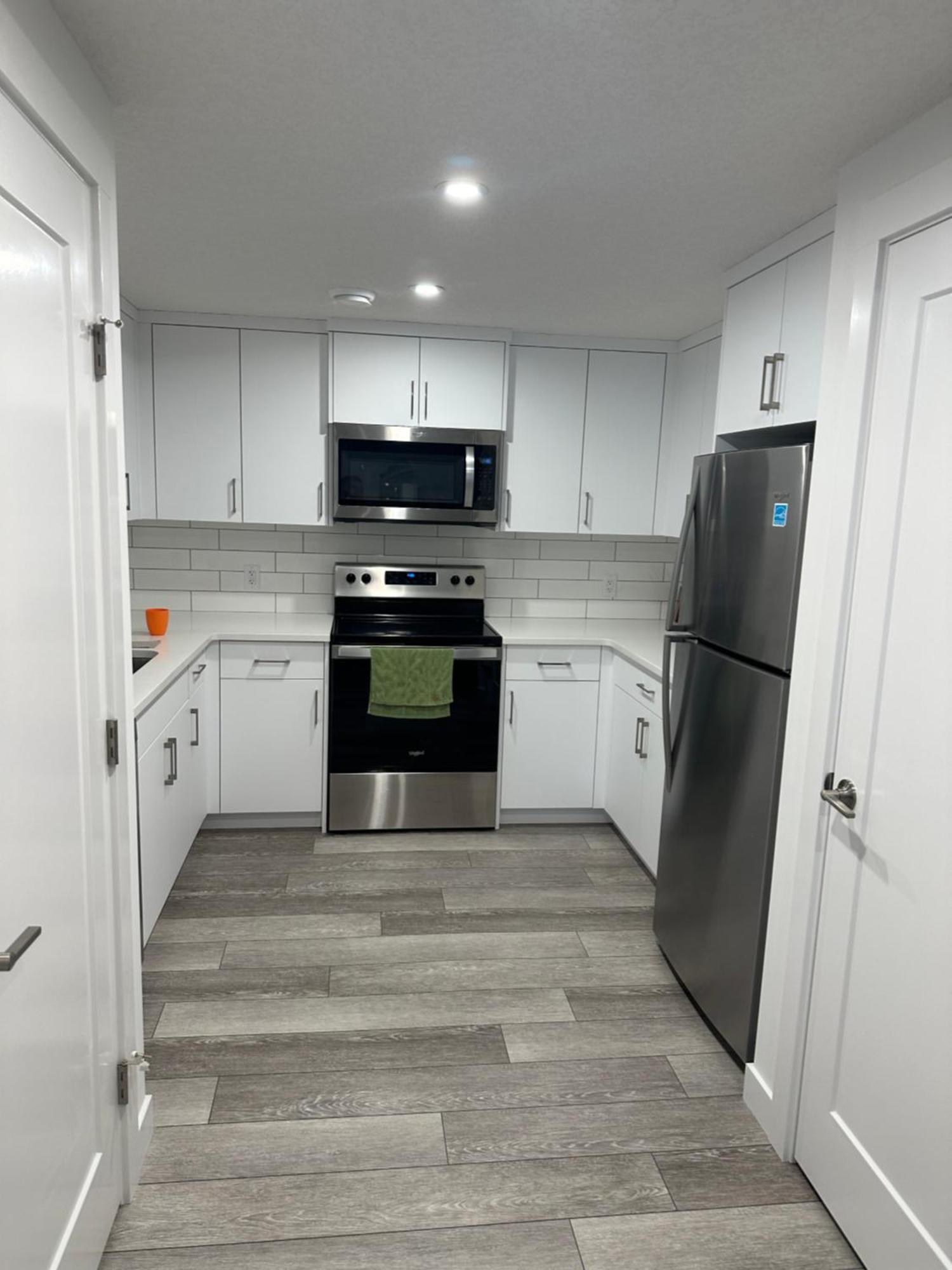 Spacious 2 Bedroom & Kitchen Basement Near Airport