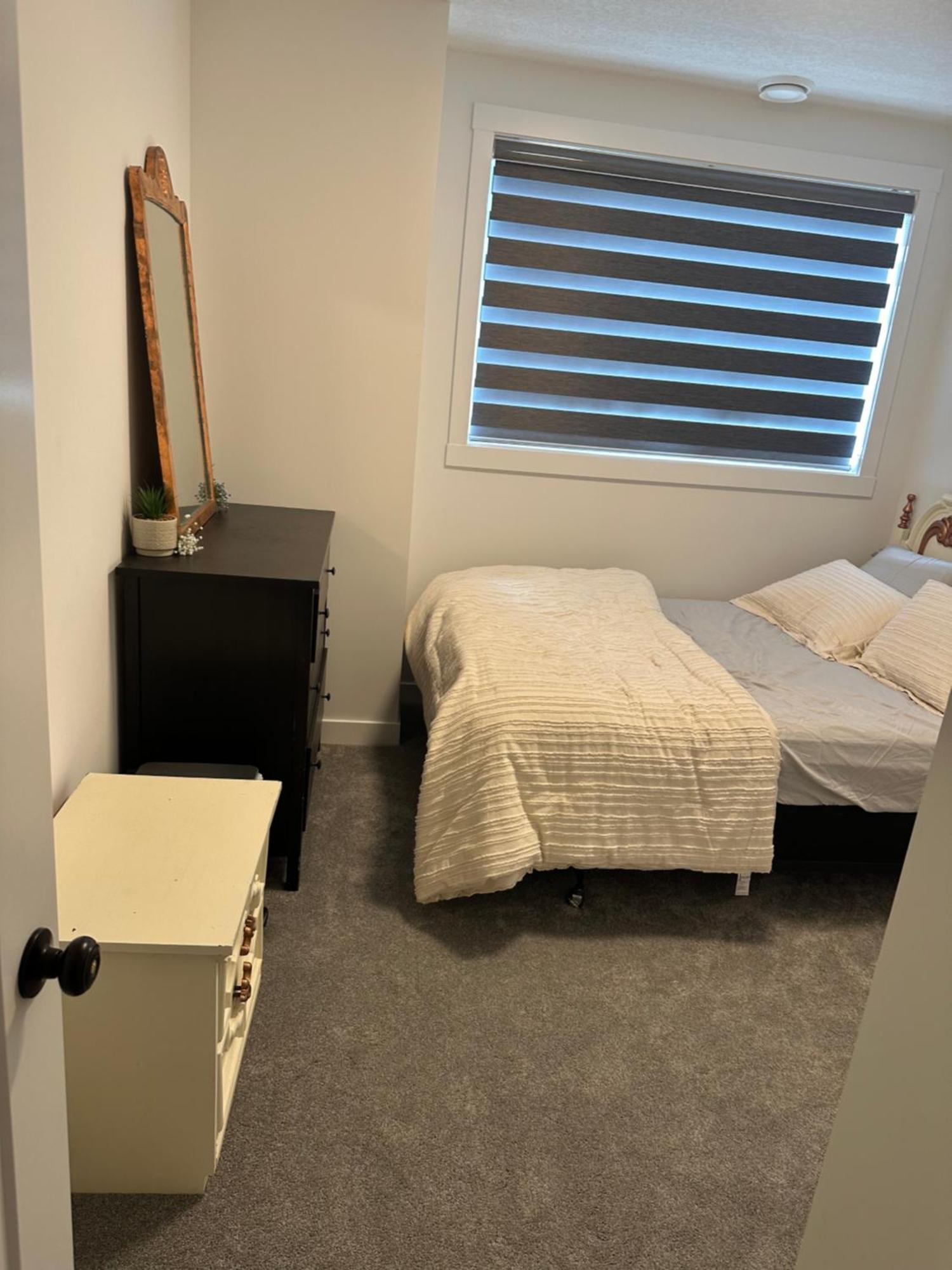 Spacious 2 Bedroom & Kitchen Basement Near Airport