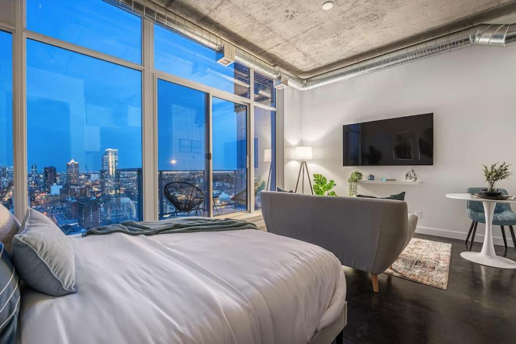 Just Steps From Stampede Park, Luxury Living Apartment
