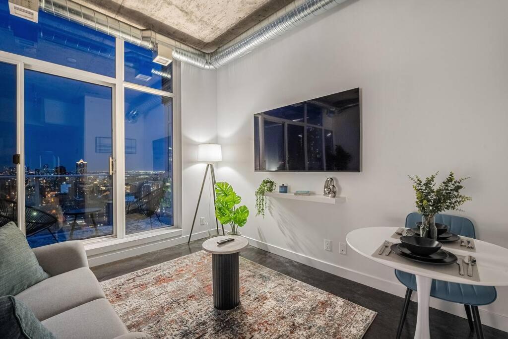 Just Steps From Stampede Park, Luxury Living Apartment